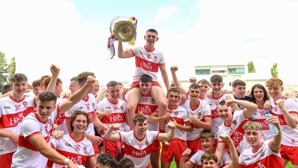 Derry captain Matthew Downey lifts the Tom Markham Cup