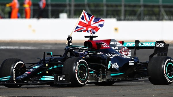 Lewis Hamilton celebrates his Silverstone success