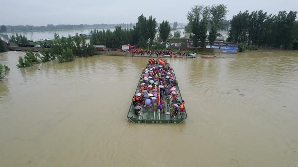 Baby rescued, mother dies in house hit by China floods