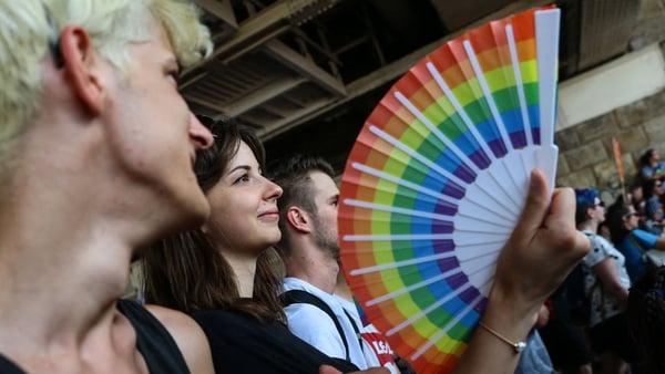 A participant holds a fan with rainbow colours during the LGBTQ Pride Parade in Budapest today