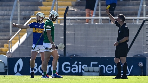 Aaron Gillane of Limerick is shown a yellow card by Paud O'Dwyer during the Munster final