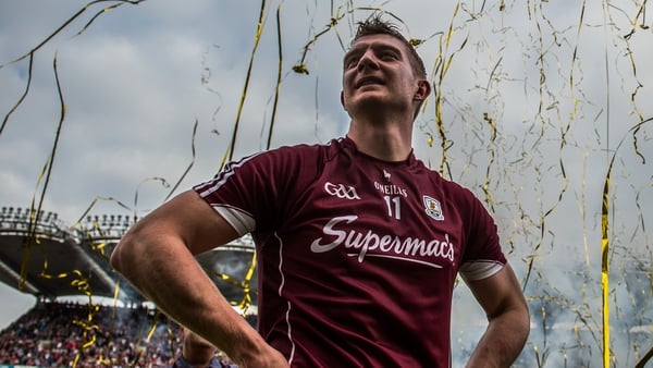 Joe Canning watches on as captain David Burke lifts the Liam MacCarthy cup in 2017