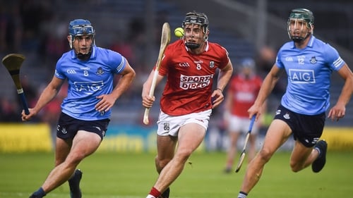 Darragh Fitzgibbon of Cork in action against Rian McBride, left, and Chris Crummey