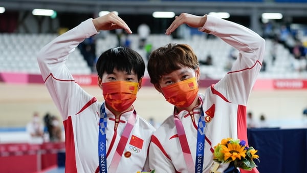 Cyclists Bao Shanju and Zhong Tianshi wore the badges during their gold medal ceremony