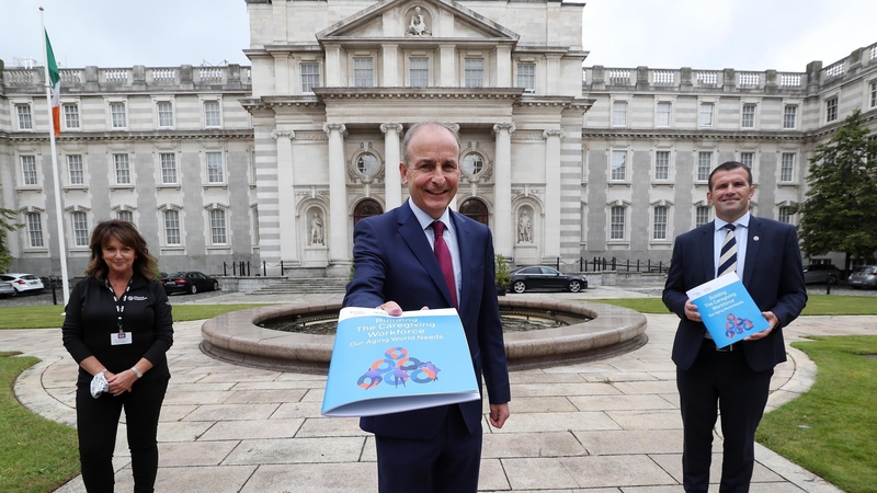 Taoiseach, Micheál Martin, Home Instead's Chief Operating Officer Shane Jennings and caregiver Ger Baldrick