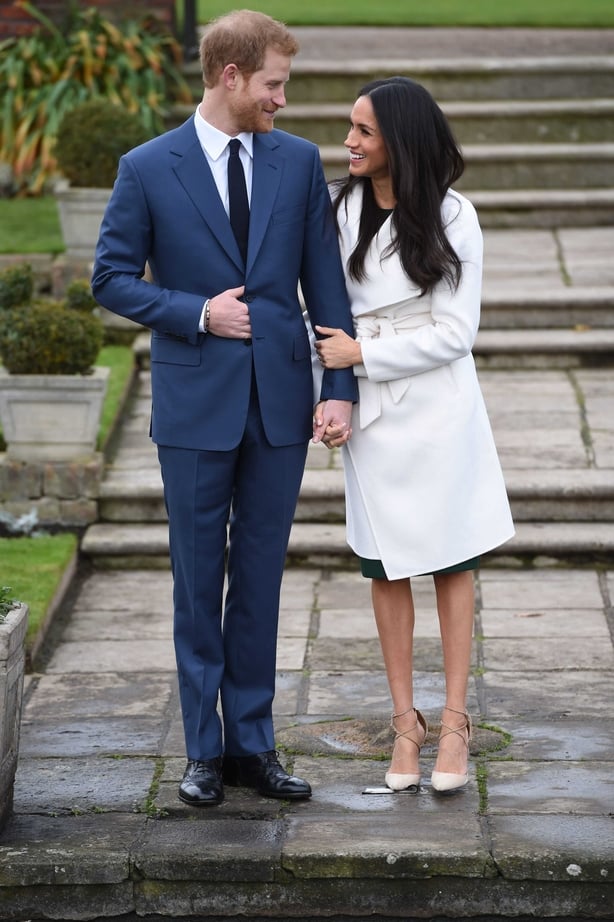 Prince Harry and Meghan Markle in the Sunken Garden at Kensington Palace, London, after the announcement of their engagement
