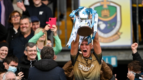 Sligo's Kyle Davey proudly lifts the cup