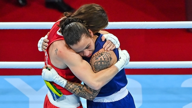 The pair embrace