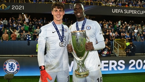 Chelsea goalkeepers Kepa Arrizabalaga (L) and Edouard Mendy celebrate with the UEFA Super Cup Trophy