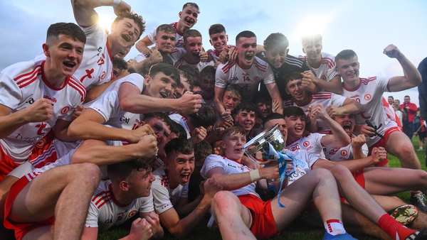 Elated Tyrone players celebrate with the cup