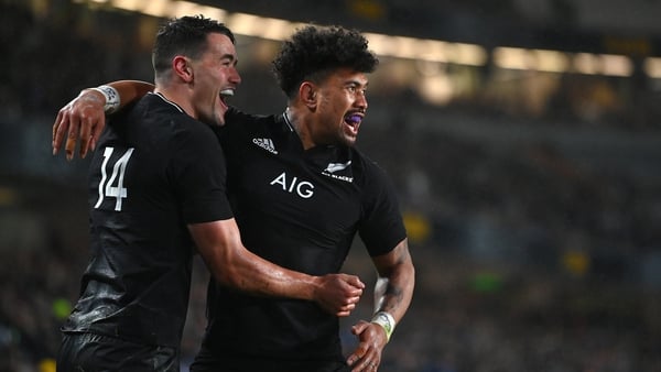 Will Jordan is congratulated on his try by Ardie Savea