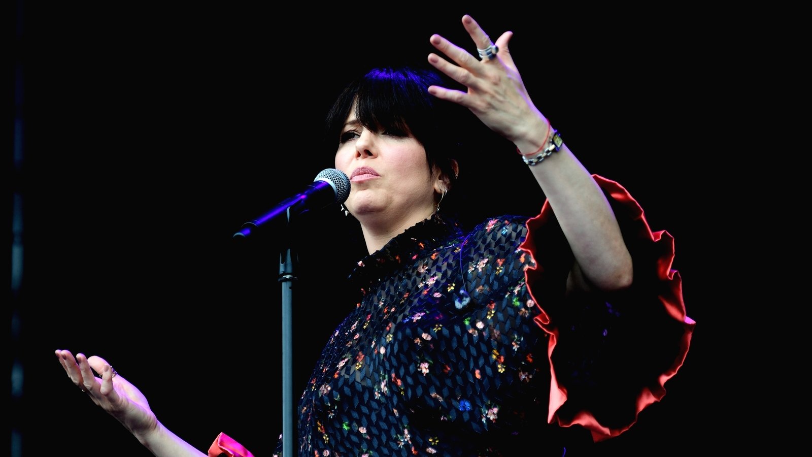 Imelda May flies between wedding and festival in designer dress