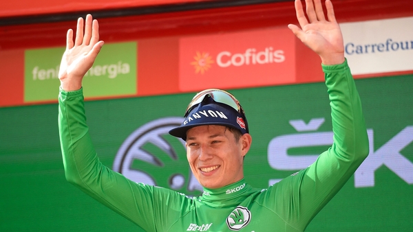 Philipsen celebrates on the podium after winning the second stage