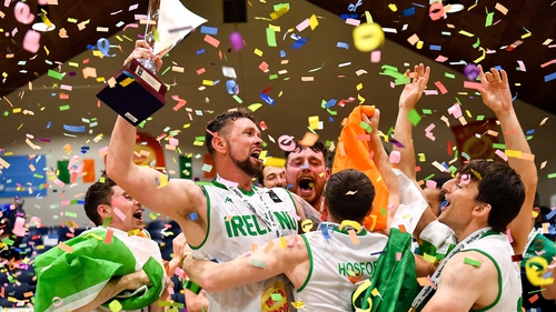 Ireland captain Jason Killeen raises the trophy in triumph