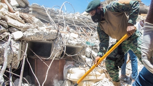 Personnel carry out debris removal, search and rescue work, in Les Cayes, Haiti