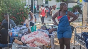 Patients are tended to outside Les Cayes General Hospital after a 7.2-magnitude
