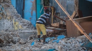 A man recovers what he can after a 7.2-magnitude earthquake struck Haiti