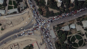 A satellite image made available by Maxar Technologies shows a traffic jam outside Kabul International Airport today