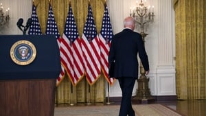 US president Joe Biden walks away from the East Room in the White House without taking questions after defending his decision to withdraw troops from Afghanistan