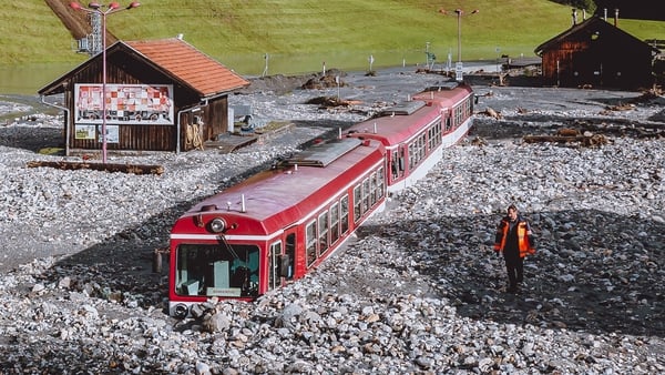 A train is stuck in the mud after flooding in Wald-im-Pinzgau near Salzburg