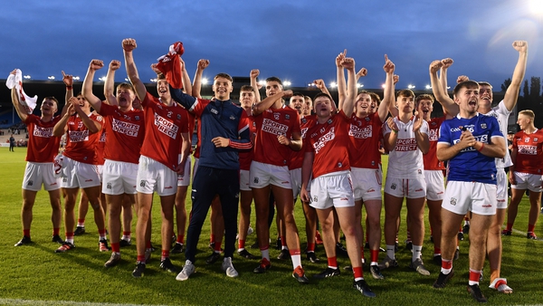 Cork Under-20 players celebrate as captain Cormac O'Brien lifts the cup