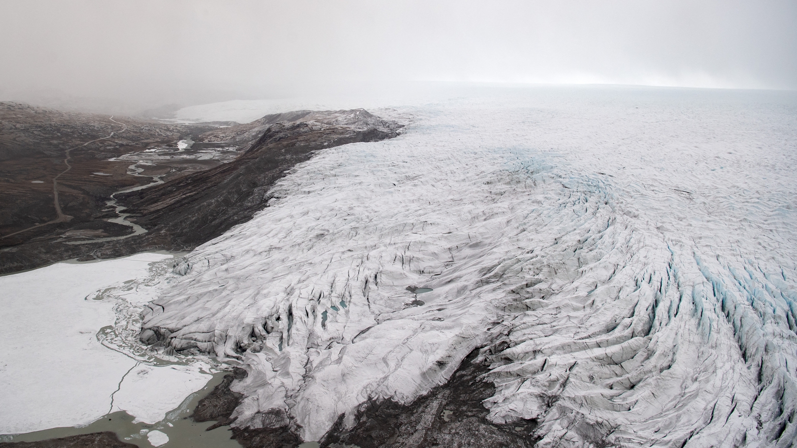 Rain falls at Greenland ice summit for first time