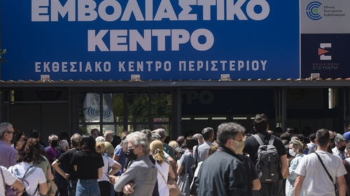People wait to enter the vaccination centre in Athens in May. Photo: Dimitris Lampropoulos/NurPhoto via Getty Images