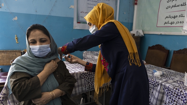A teacher from Kabul's Zarghoona high school pictured getting the J&J vaccine in July