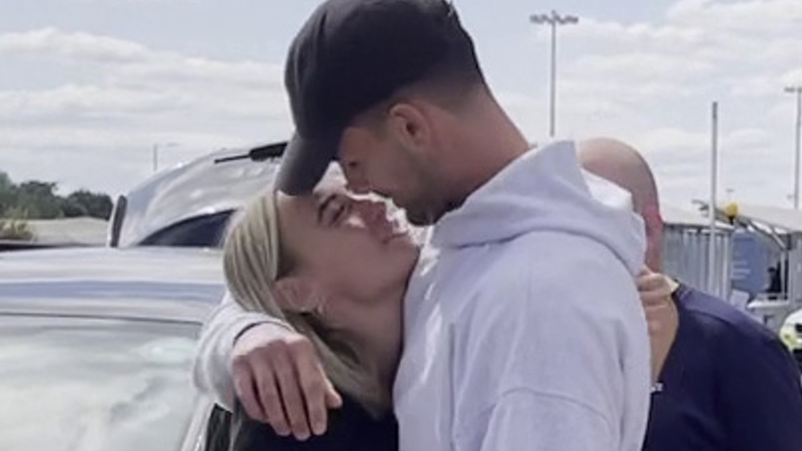 Love Island winners share kiss as they touch down in UK