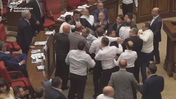 A member of the ruling party tried to kick the opposition politician, sparking mass fighting on the chamber's floor (Pic: Radio Free Europe)