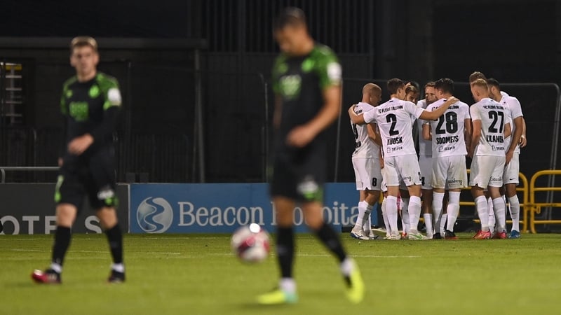 Flora players celebrate the only goal of the game in Tallaght