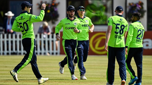 Andrew Balbirnie is congratulated by team-mates after catching Zimbabwe's Craig Ervine