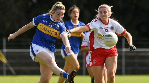 Aisling McCarthy of Tipperary gets her shot away as Tyrone's Aiobhinn McHugh closes in.