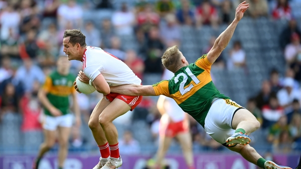 Kieran McGeary gets out in front of Tommy Walsh