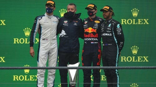 Russell (l), Verstappen (second from right) and Hamilton (r) on the podium