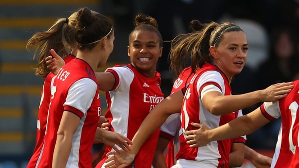 Nikita Parris celebrates with Katie McCabe (r) and other Arsenal team-mates after scoring the first goal