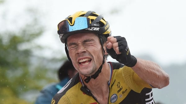 Primoz Roglic celebrates as he wins the 17th stage