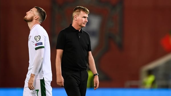 A dejected Stephen Kenny and Matt Doherty after the final whistle in Portugal