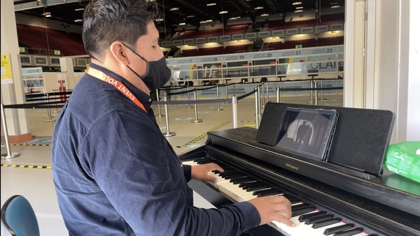 Nelson Aguilar, from Bolivia, is a volunteer pianist at the centre