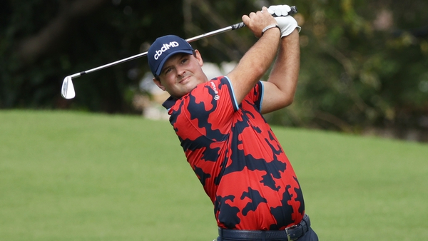 Patrick Reed playing a shot on the first hole during the first round at the Tour Championship