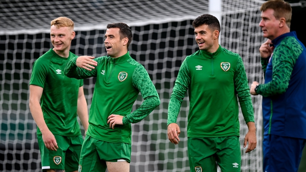 Latest call-up Liam Scales, captain Seamus Coleman and John Egan share a joke as Stephen Kenny looks on during a training session