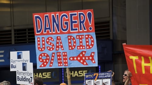 9/11 conspiracy theorists protested outside the memorial service at the World Trade Center construction site marking the 10th anniversary of the attacks on 11 September 2001