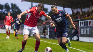 Ronan Coughlan of St Patrick's Athletic in action against Garry Buckley of Sligo Rovers