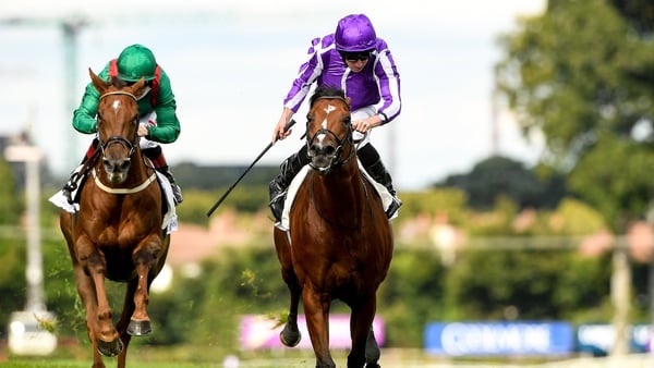 St Mark's Basilica, right, with Ryan Moore up, on their way to winning the Irish Champion Stakes from second place Tarnawa