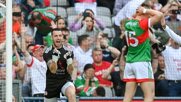 Niall Morgan celebrates as Ryan O'Dnoghue (R) penalty goes wide