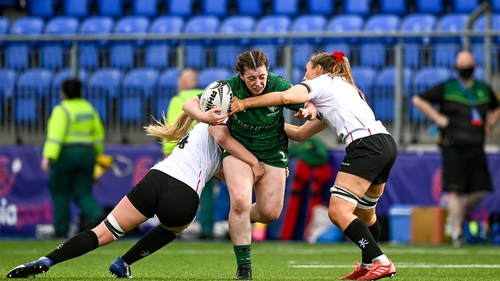 Meadbh Scally of Connacht is tackled by Lauren Maginnes, right, and Taryn Schutzler of Ulster during Saturday's clash
