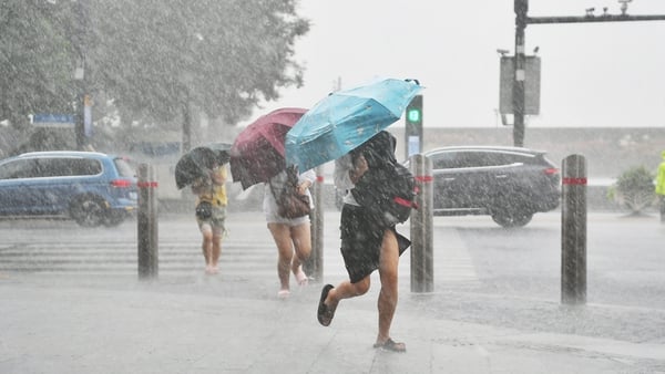 The storm was downgraded over the weekend, but Shanghai officials maintained an orange typhoon alert for today
