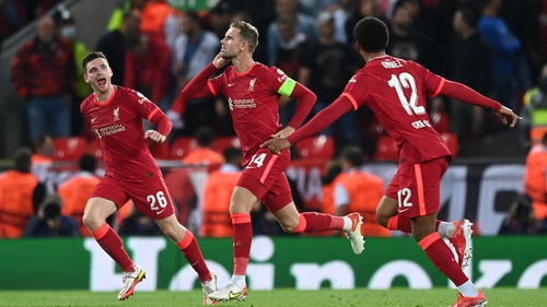 Jordan Henderson celebrates with Liverpool team-mates Joe Gomez and Andrew Robertson after scoring their side's third goal