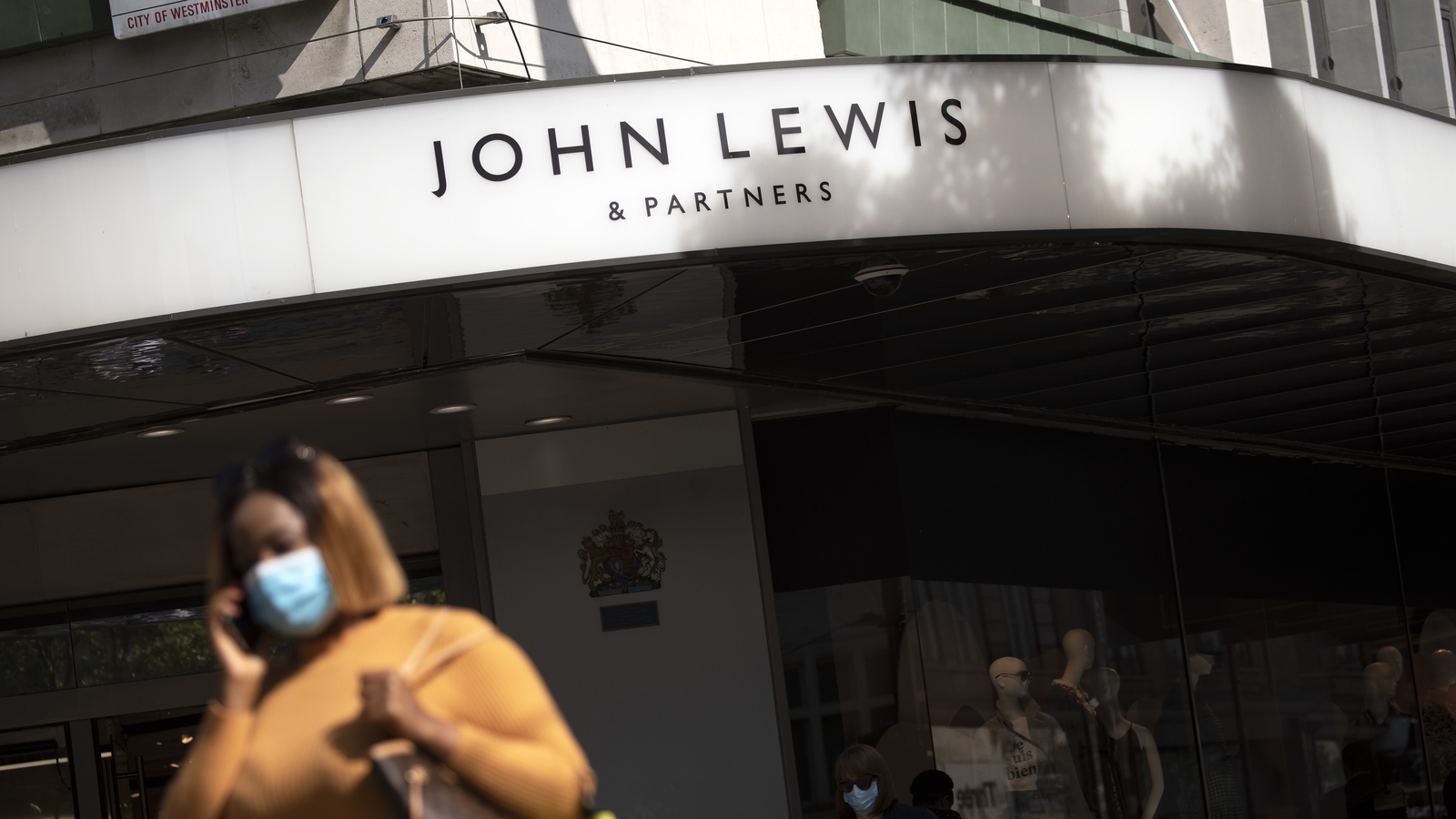 John Lewis returns to profit but warns of uncertainty
