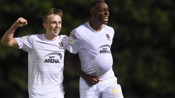 Prince Mutswunguma (R) of Waterford celebrates with team-mate Darragh Power after scoring the winner